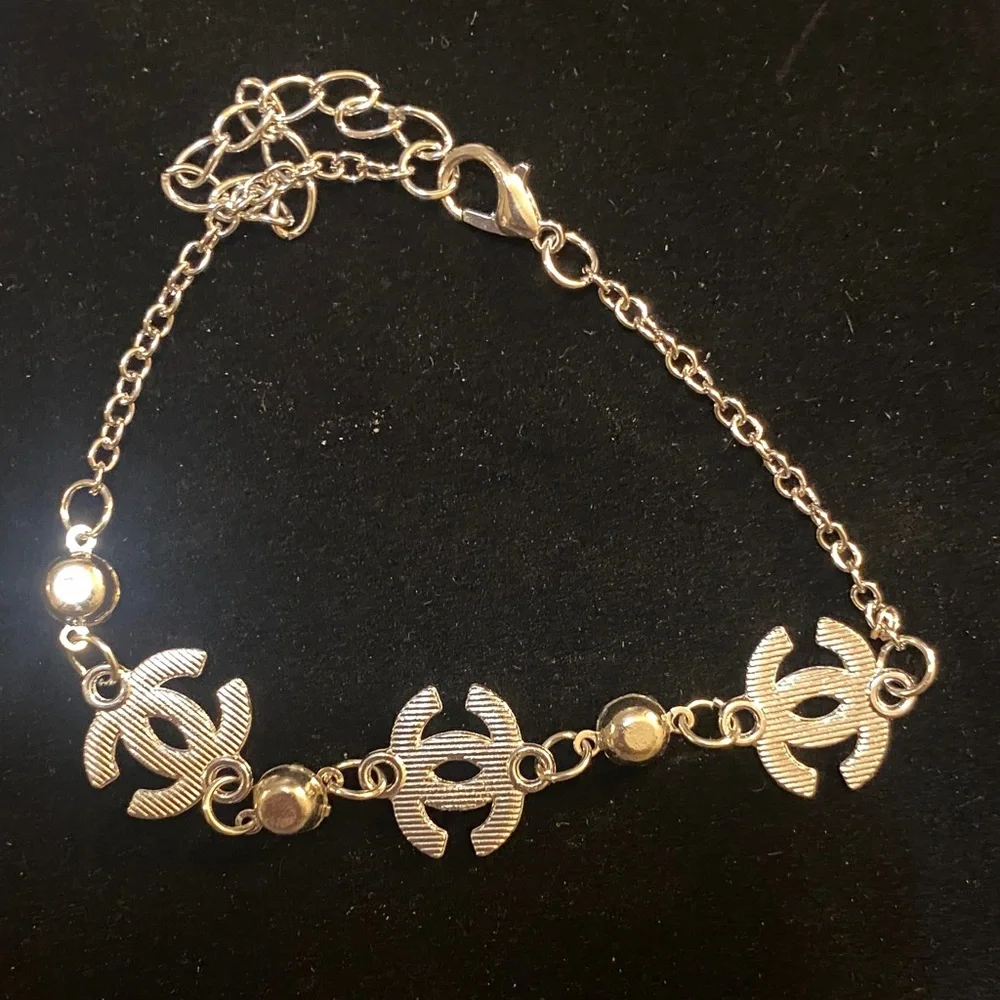 Elegant Silver toned CC Bracelet with Crystal Accents